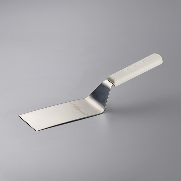 A Dexter-Russell square edge hamburger turner with a white handle.