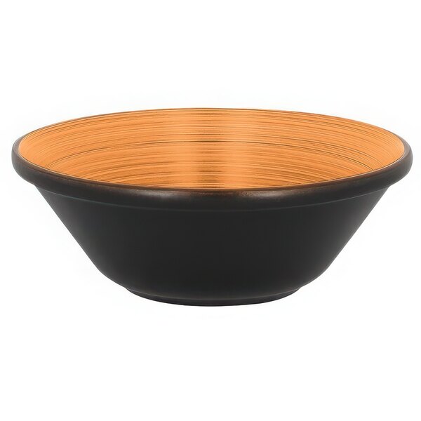 A black bowl with a brown rim and wooden accents on a counter.