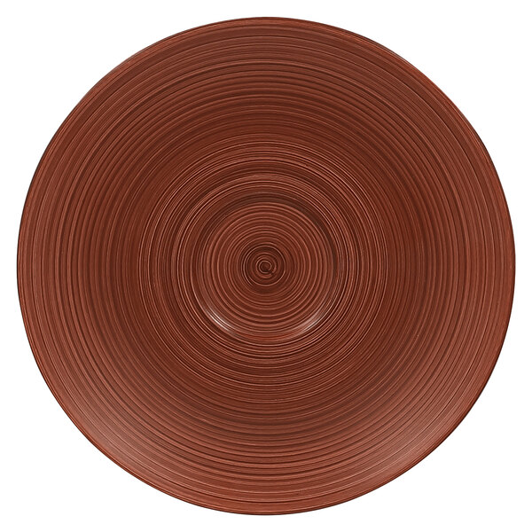 A brown circular RAK Porcelain saucer with spirals.