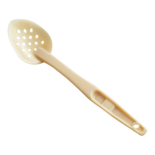 A beige plastic Cambro spoon with holes in it.