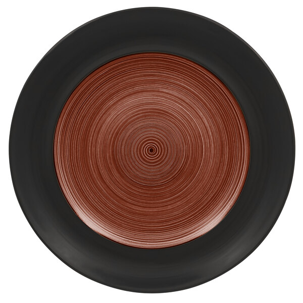 A white porcelain plate with a walnut and black circular design on the rim.