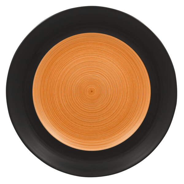 A close up of a RAK Porcelain Trinidad wide rim plate with a black and cedar rim.