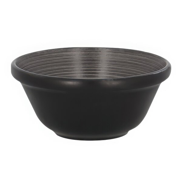 A RAK Porcelain Trinidad black bowl with a grey stripe on a counter.