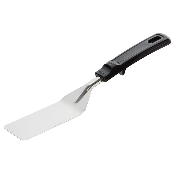 A Vollrath small blade turner with a black handle and white grip.