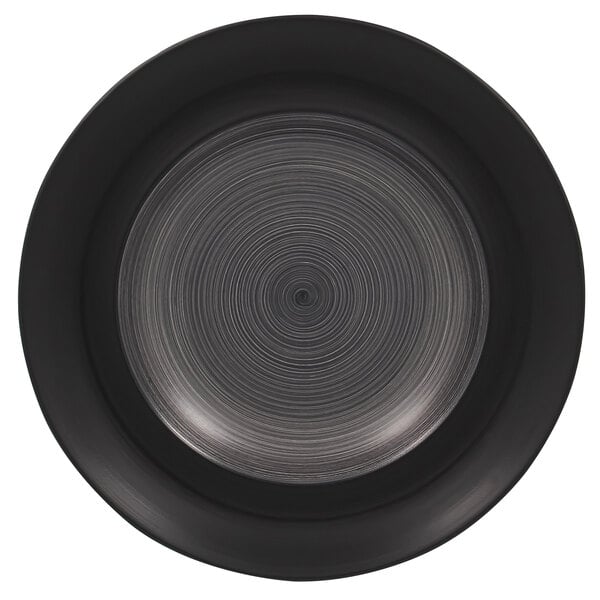 a circular black surface with a spiral pattern