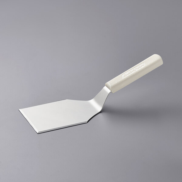 A white spatula with a white handle.