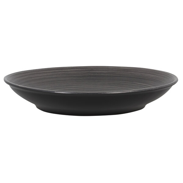 A black porcelain plate with a white background and striped pattern.
