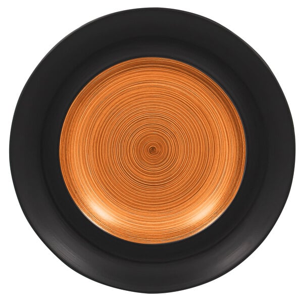 A close up of a RAK Porcelain Trinidad wide rim deep porcelain plate with a cedar and black spiral design.