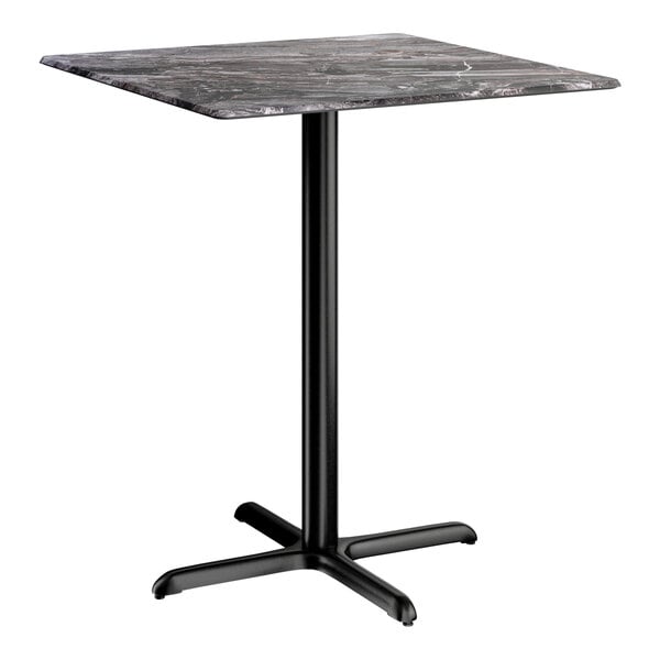 A square bar height table with a smooth dark finish top and a black cross base plate.