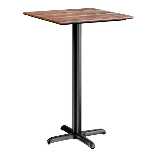 A square bar height table with a textured Yukon oak finish top and a black cross base plate.