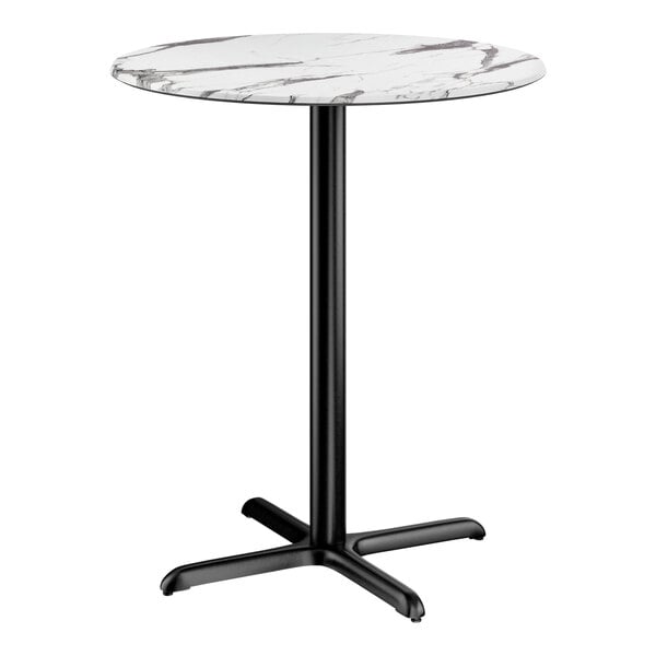A round bar height table with a smooth white marble-look top and a black cross base plate.