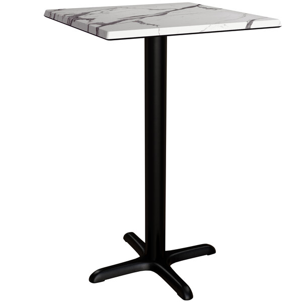 A Lancaster Table & Seating counter height table with a marble top and black cross base.