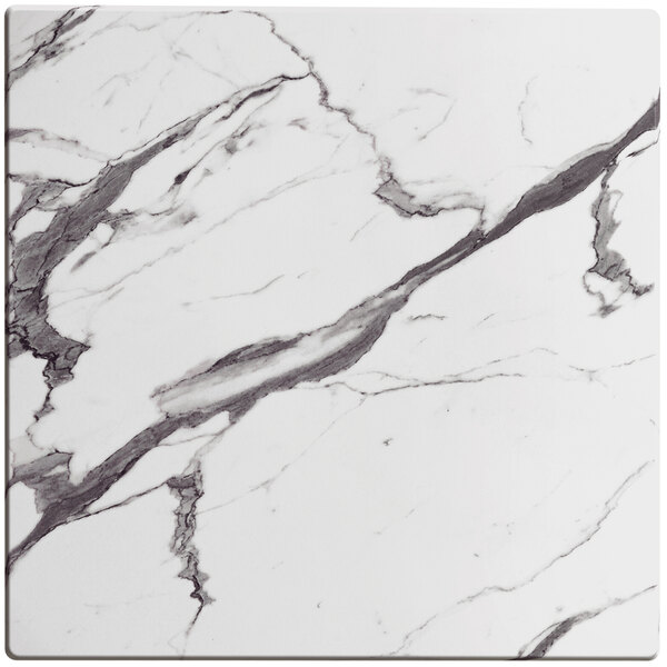 A white marble square tile with black and white lines.