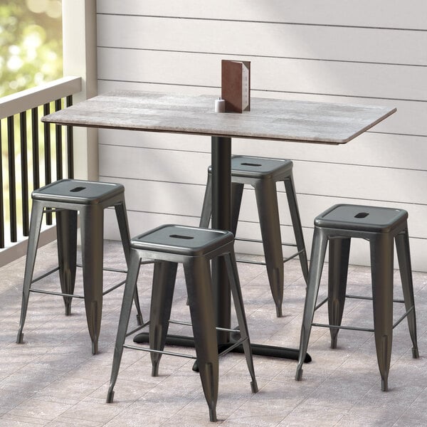 a group of stools on a tile floor