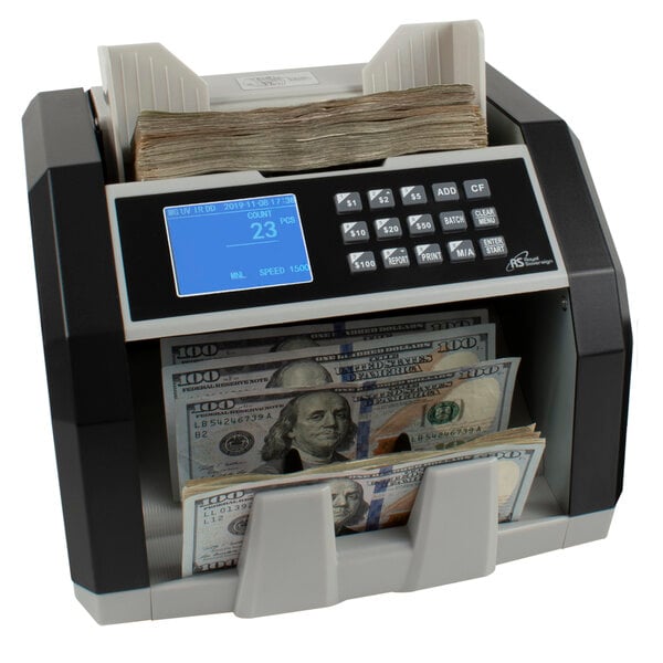 A Royal Sovereign bill counting machine with cash inside and an external digital display.