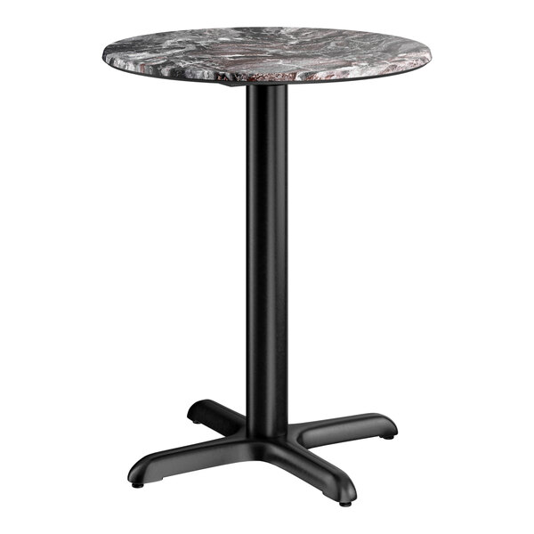 A round standard height table with a smooth Paladina finish top and a black cross base plate.