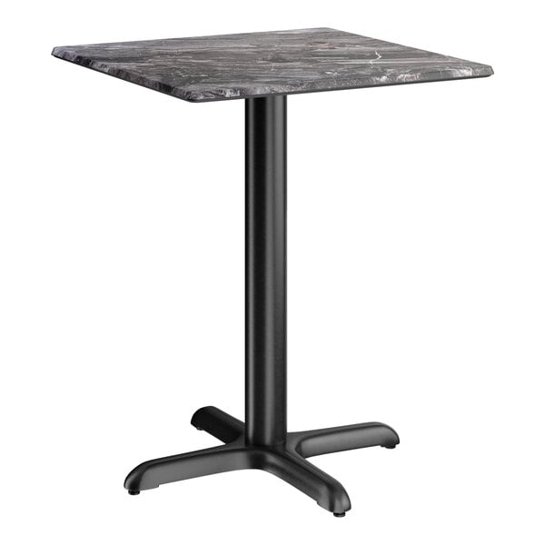 A square standard height table with a smooth dark finish and a black cross base plate.