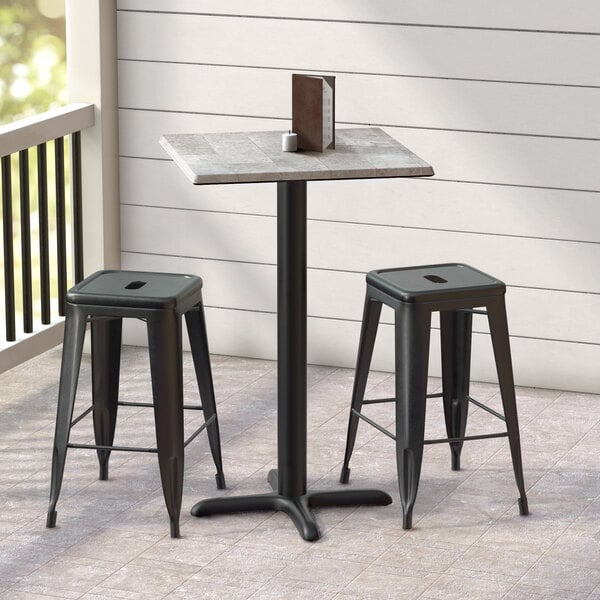 A Lancaster Table & Seating Excalibur square counter height table with a textured Toscano finish and cross base plate.