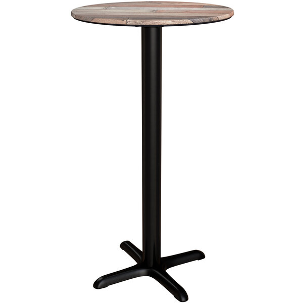 A Lancaster Table & Seating round bar height table with a mixed plank top on a black base.
