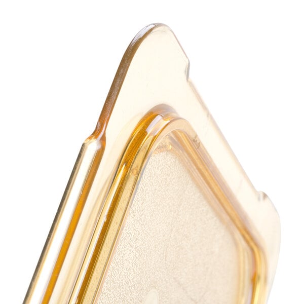 A clear plastic case with a yellow Carlisle StorPlus lid.