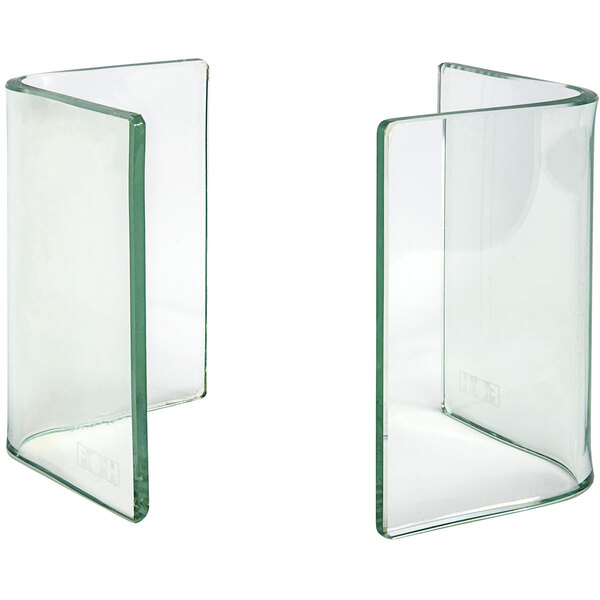 Two clear glass L-shape risers.