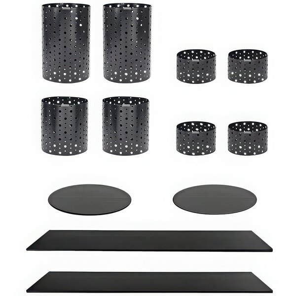 A black stainless steel riser set with black bamboo boards with white dots on a table.