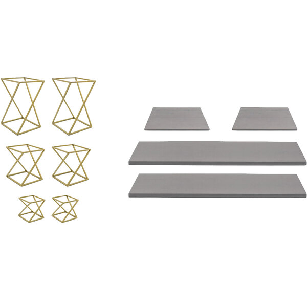 A set of geometric stainless steel risers with a matte brass finish and smoke bamboo boards.