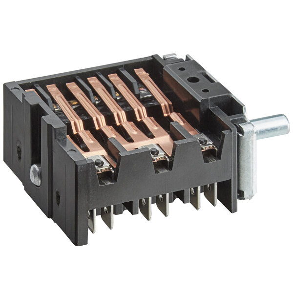 A small black electrical switch with copper colored wires.