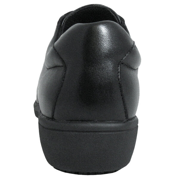 A Genuine Grip black leather shoe with a sole and a heel.