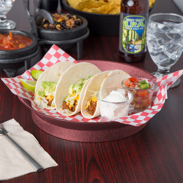 A table with a group of HS Inc. raspberry deli servers filled with tacos, salsa, and sauce.