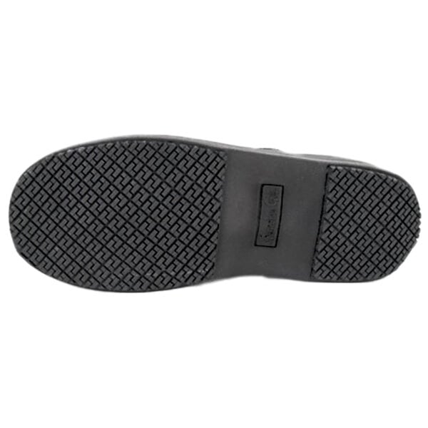 The image shows the black rubber sole of a shoe with a textured, slip-resistant tread pattern.