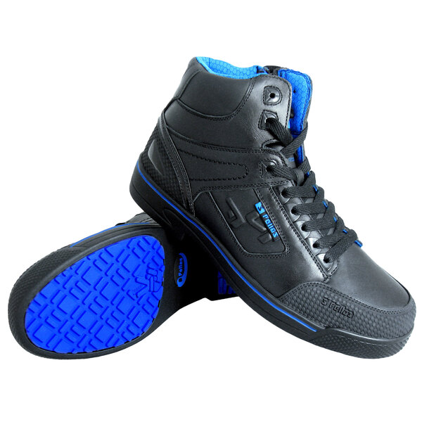A pair of Genuine Grip black and blue shoes with blue soles and laces.