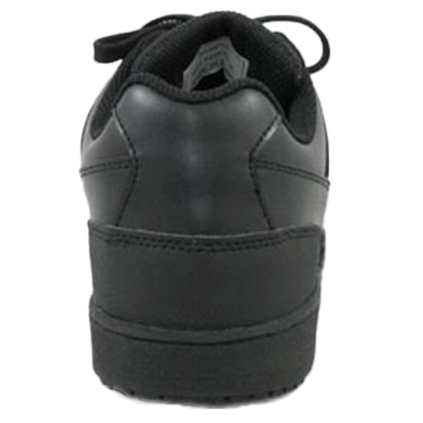 A close up of a Genuine Grip black leather shoe with a rubber sole and lace.