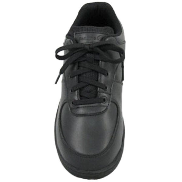 A close-up of a Genuine Grip black leather sport shoe with laces.
