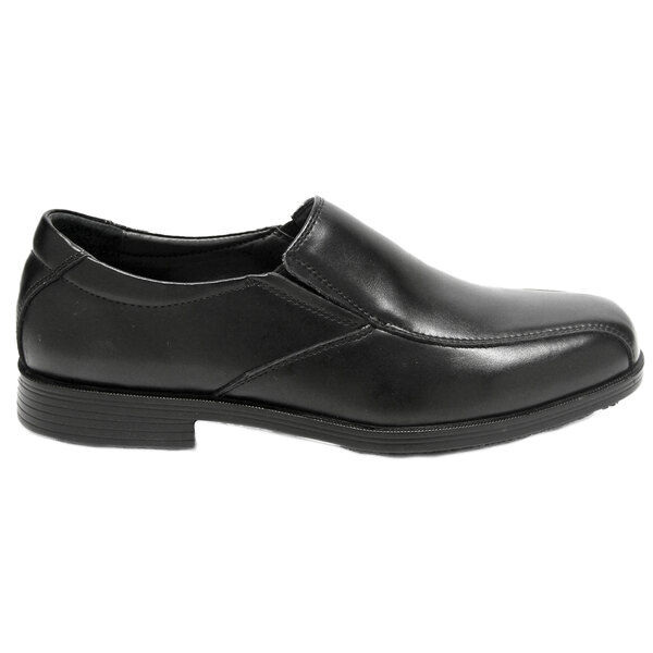A black Genuine Grip men's slip-on dress shoe with a rubber sole.