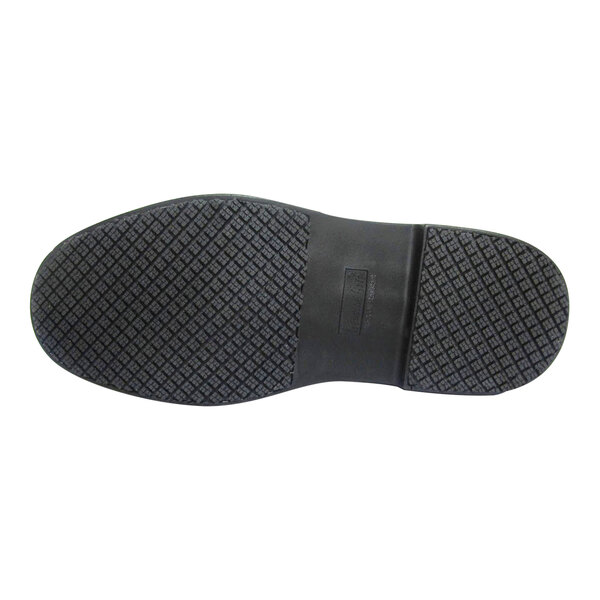 The black rubber sole of a Genuine Grip men's non slip leather boot.