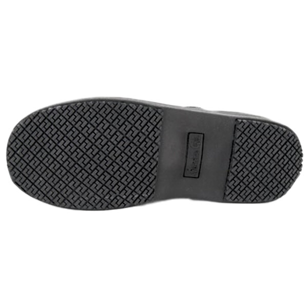 The image shows the black rubber sole of a shoe with a textured, slip-resistant tread pattern.