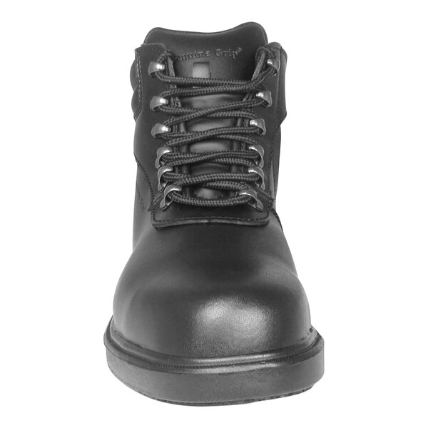 A close-up of a Genuine Grip black leather work boot with laces.