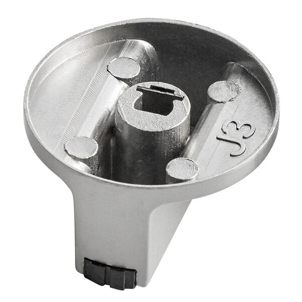 A stainless steel Avantco knob plate with a hole in the middle.