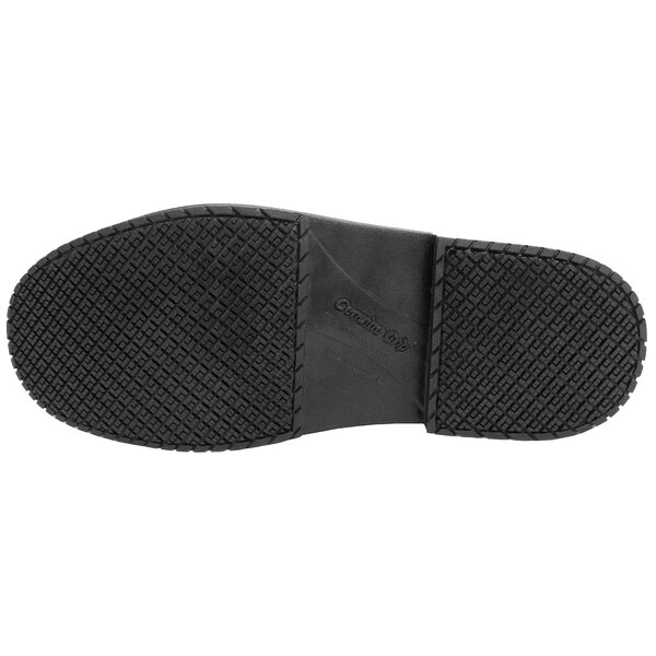 The image shows the black rubber sole of a shoe or boot with a textured, slip-resistant pattern.