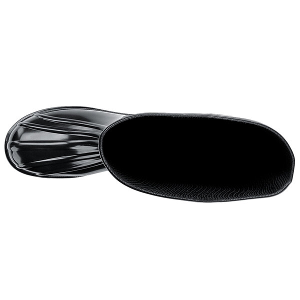 A black rubber Shoes For Crews work boot with a rubber sole.