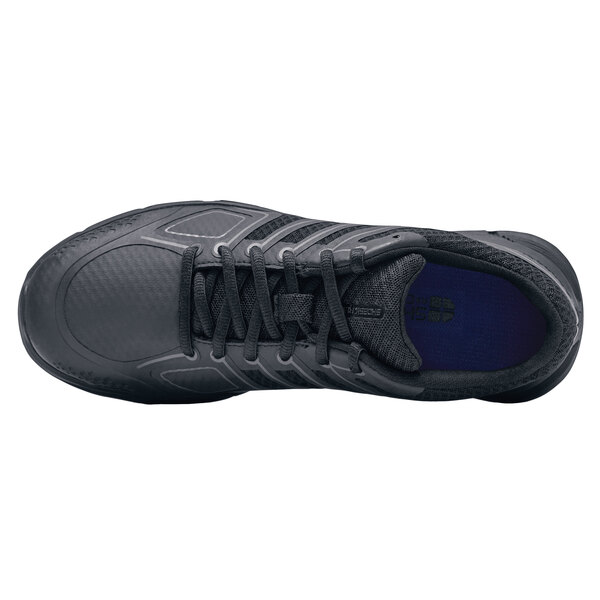 A black Women's Shoes For Crews athletic shoe with a blue sole.