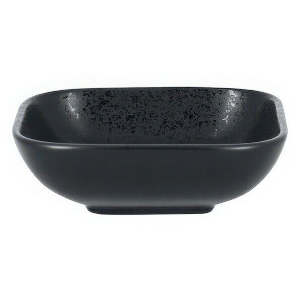 A black rectangular RAK Porcelain serving dish with black speckled edges.