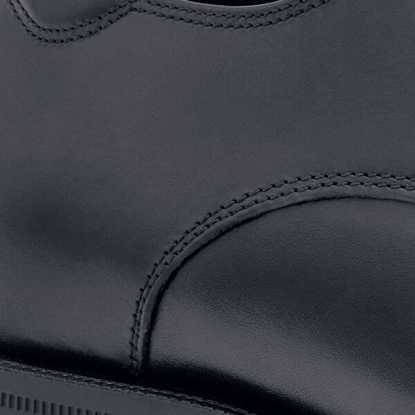 A close-up of a black leather Shoes For Crews Senator dress shoe.