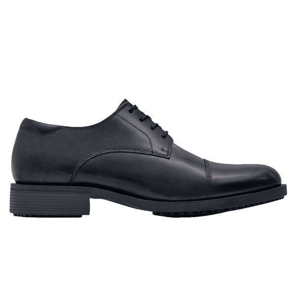 A black Shoes For Crews Senator dress shoe with laces and a rubber sole.
