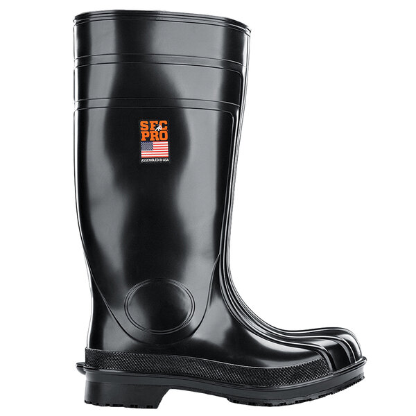 A black Shoes For Crews work boot with a black rubber sole and an orange logo on the side.