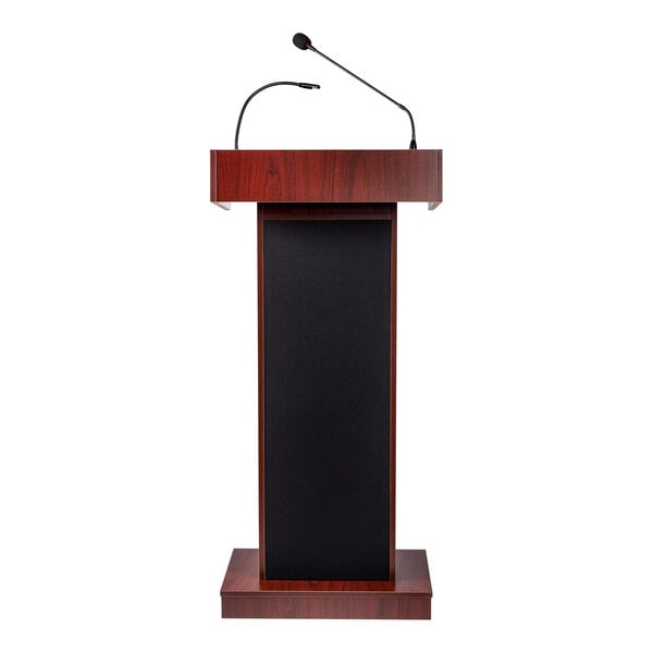 A mahogany finish lectern with built-in sound system and attached microphones.
