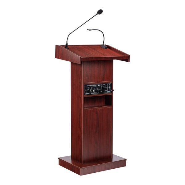 A wooden lectern with a mahogany finish, built-in sound system, and attached microphones.