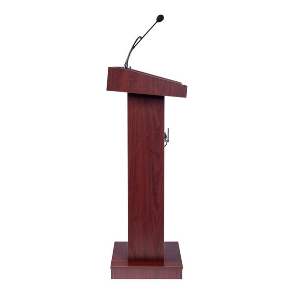 A wooden lectern with a mahogany finish and an attached microphone.