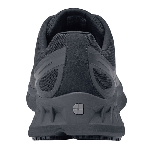 The back of a black Shoes For Crews Endurance II men's athletic shoe with a white sole.